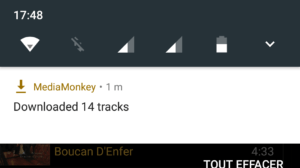 Capture d'écran de l'application MediaMonkey Android, la notification affiche "Downloaded 14 tracks".